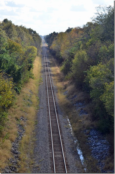 Back in Fulton we discovered a freight departing northbound. I assumed it to be heading out the Bluford District, although I should have stopped briefly on the Purchase Parkway bridge and made sure! We raced up the Purchase Parkway and exited somewhere. Through several intersections and sharp turns we made it over to Dublin. The KY 1748 bridge yielded the shot below.